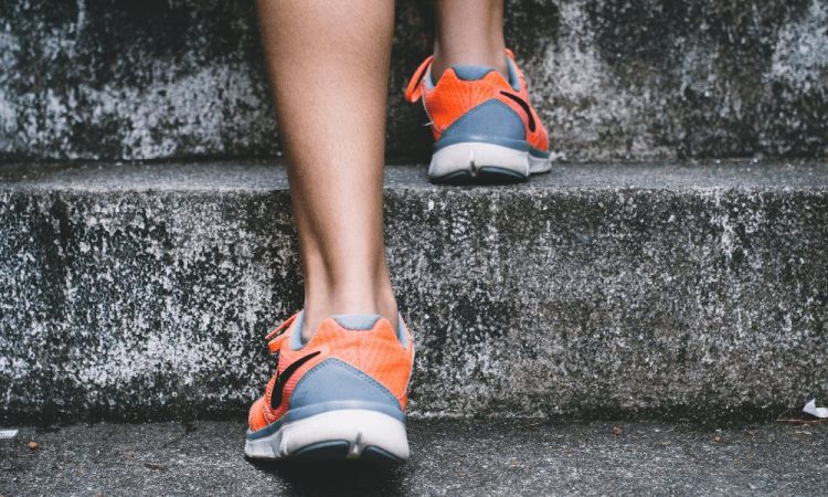 person taking healthy steps up stairs