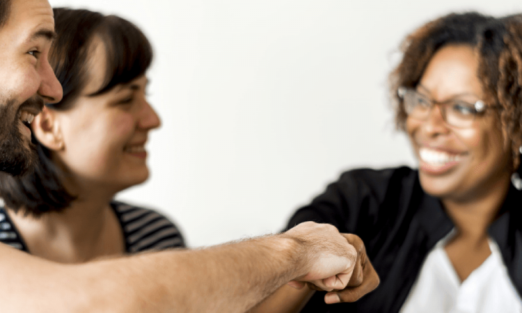 employee giving fist bump